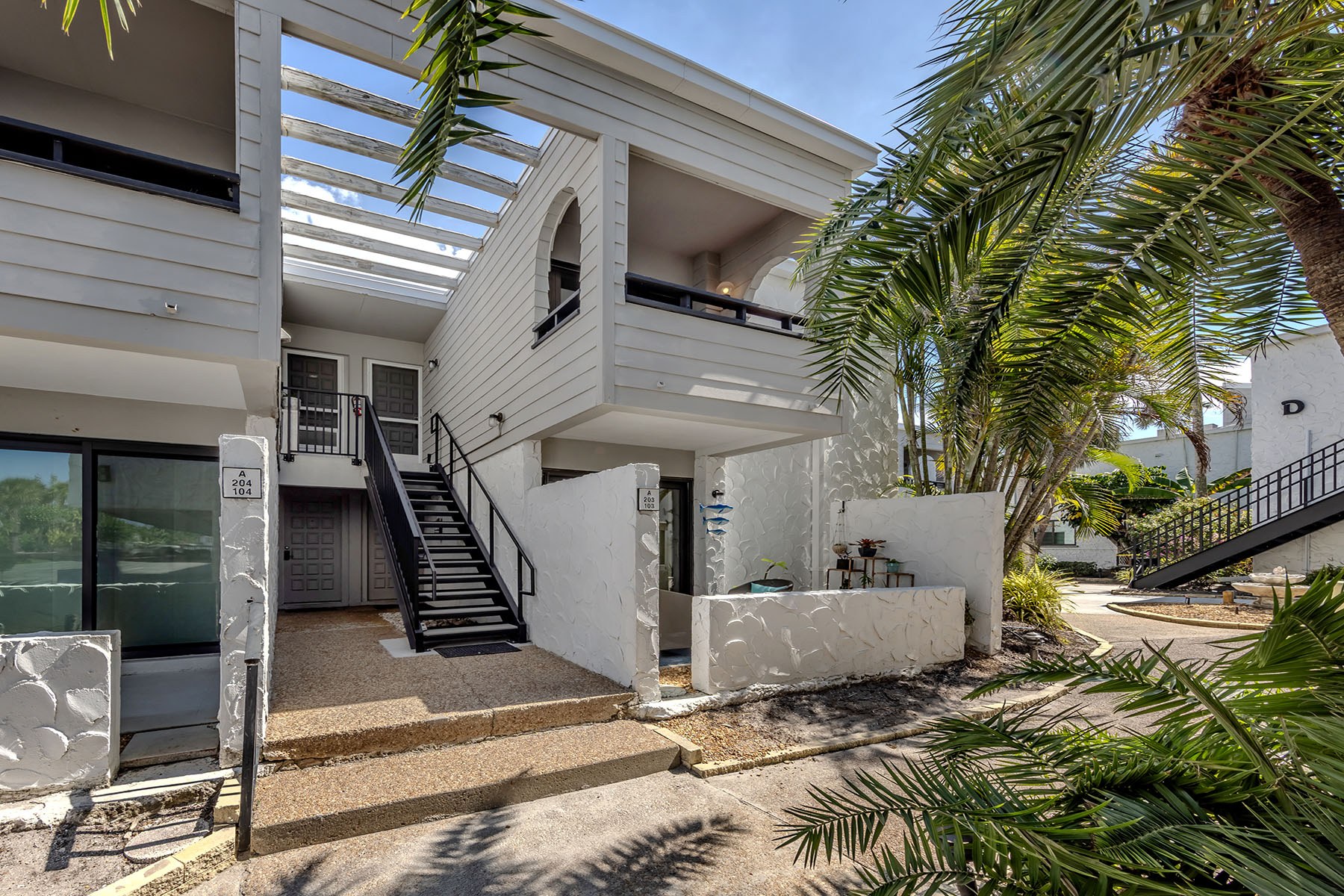 Building A entry at Bahia Vista Gulf with stairs to unit 203