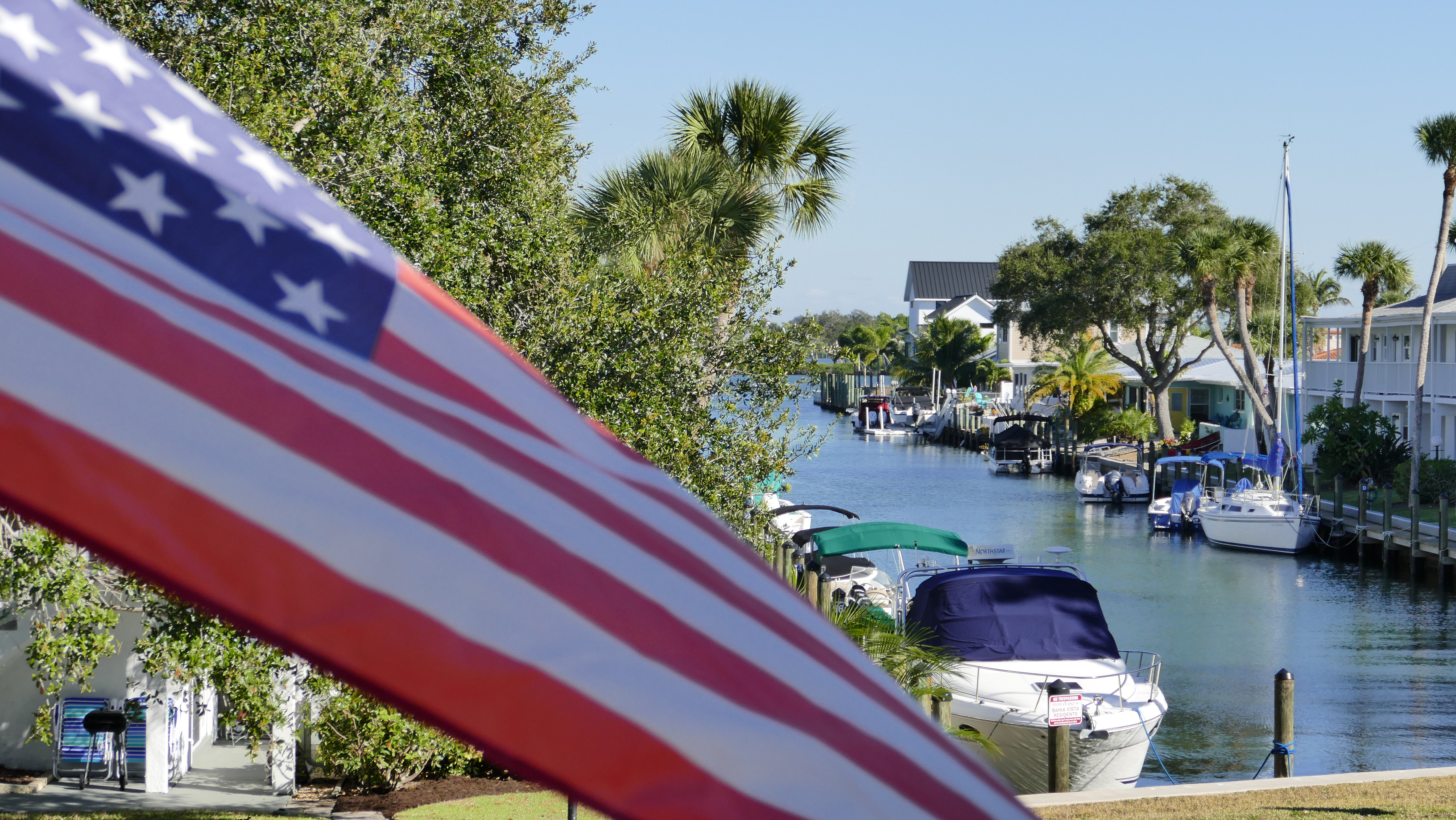 American flag and boats along the Bahia Vista canal
