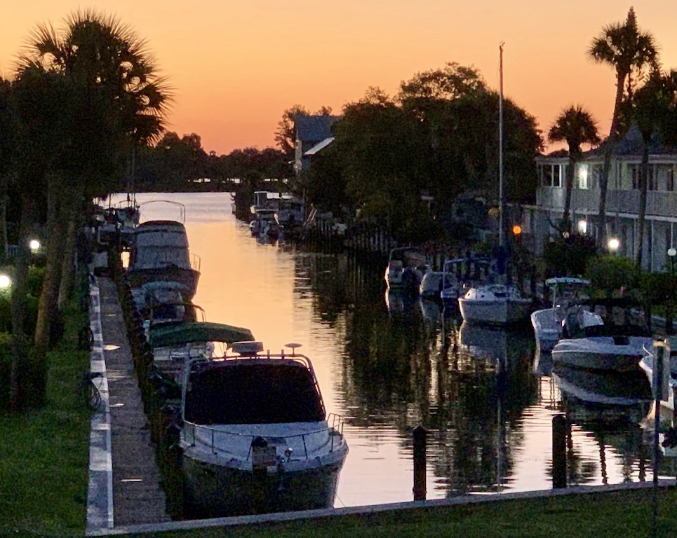 Canal at sunset with docked boats