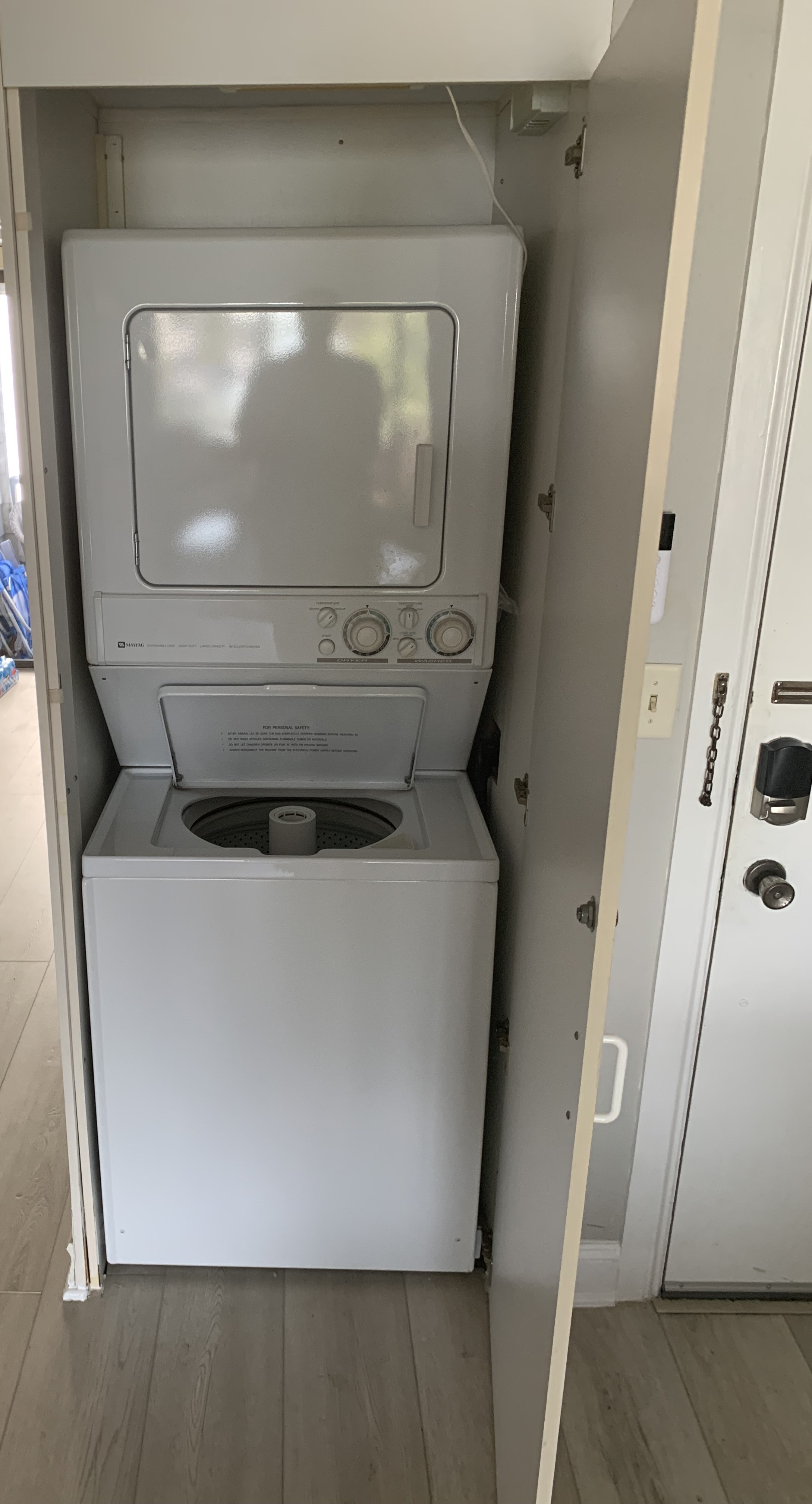 In-unit stacked washer and dryer in a closet